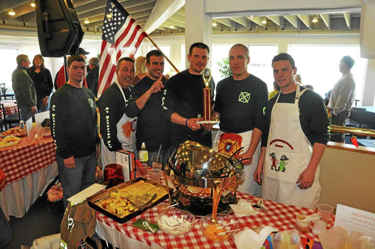 Members of the Milford Fire Department with the Judge’s Choice trophy they won at the 2012 Chili Festival. Contributed photo