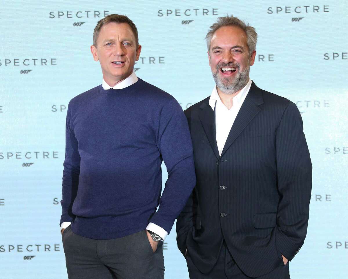 Actor Daniel Craig and Director Sam Mendes pose for photographers pose for photographers at the announcement for the new Bond film, the 24th in the series, at Pinewood Studios in west London, Thursday, Dec. 4, 2014. The titile of the new Bond production is Spectre. (Photo by Joel Ryan/Invision/AP)