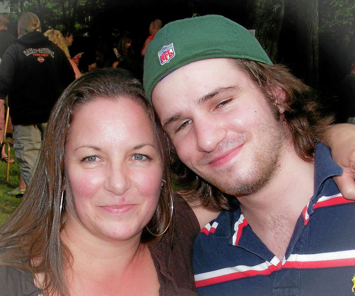 This 2012 photo provided by Sandy Bannon shows Margaret Rohner, left, with her son Bobby Rankin. The day after Christmas 2013, Rohner, 45, was viciously attacked with a fireplace poker, her eviscerated body left in the living room of her Deep River, Conn., home. Rankin, 23, was charged with her murder. (AP Photo/Sandy Bannon)