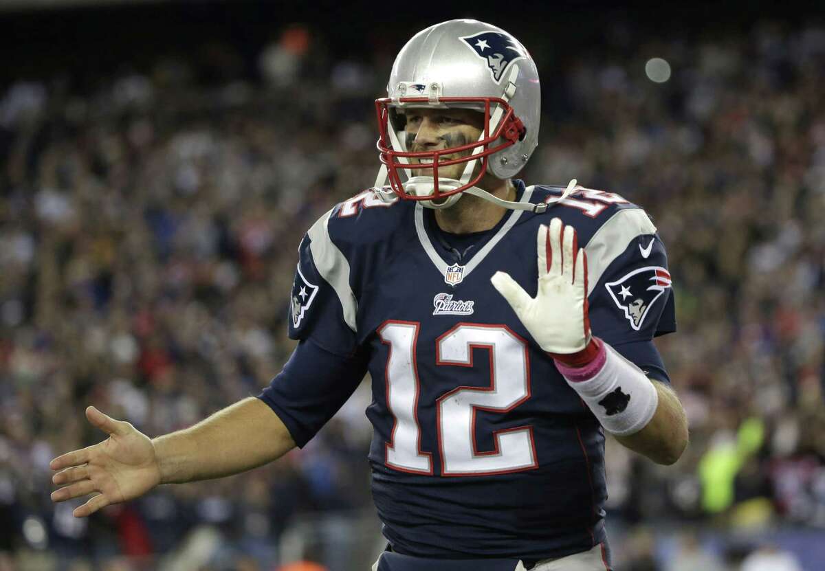 The Associated Press Patriots quarterback Tom Brady celebrates a touchdown in the first half on Sunday.