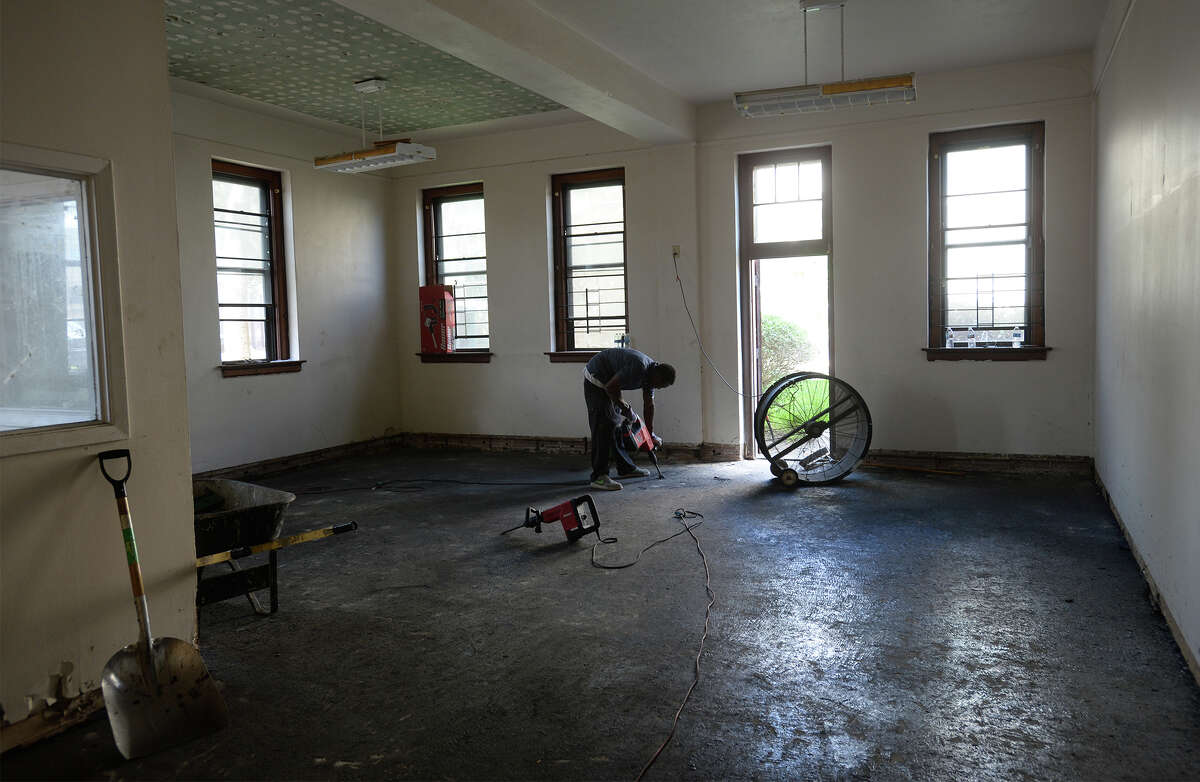A worker removes debris from the floor of a room at the former Westminster Presbyterian Church in downtown Beaumont on Wednesday. The structure was recently purchased by the Riverside Church. Riverside has been meeting in the Children's Museum at the Beaumont Civic Center. Photo taken Wednesday, July 20, 2017 Guiseppe Barranco/The Enterprise