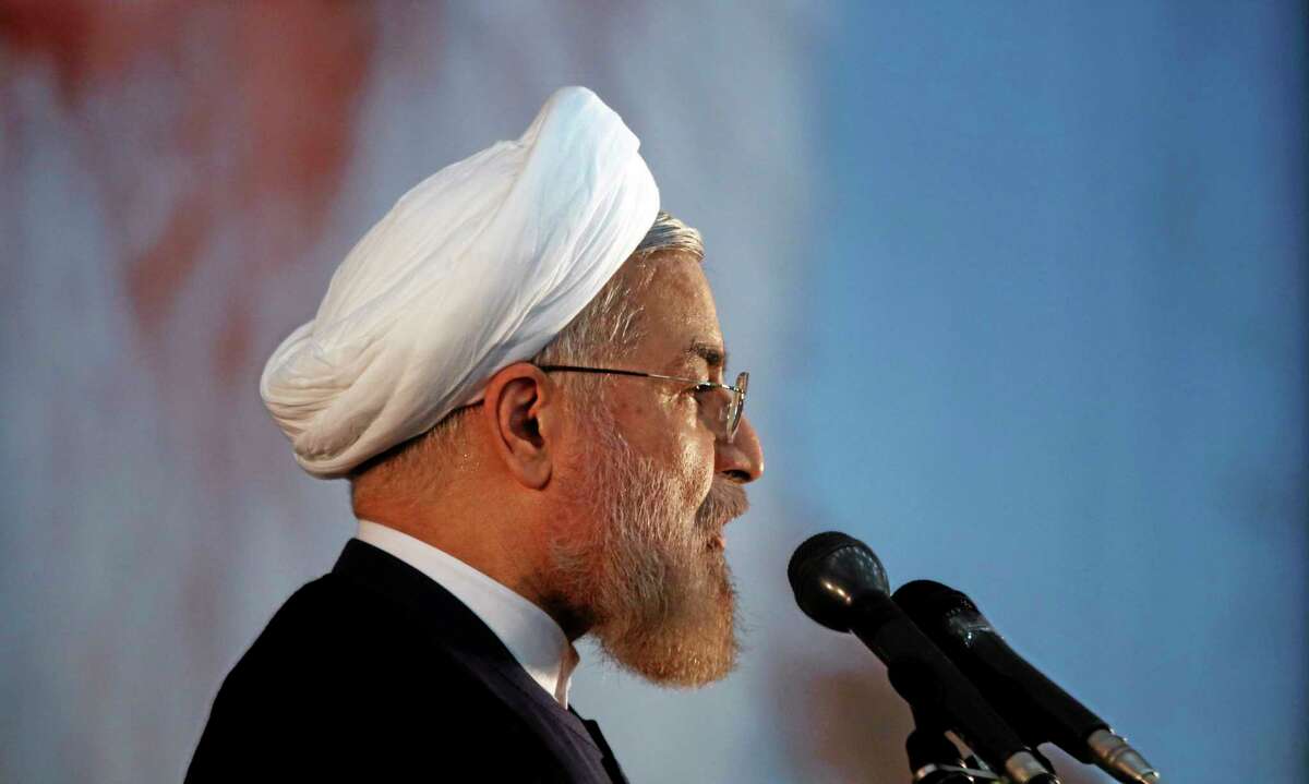 In this recent photo, Iranian President Hassan Rouhani makes an address during a ceremony marking the 25th death anniversary of Ayatollah Khomeini, the founder of the Islamic Republic, at his shrine just outside Tehran, Iran, in early June. Iran’s moderate president said Tuesday that his administration will defend the Islamic Republic’s nuclear rights and work to end international sanctions that have devastated its economy.