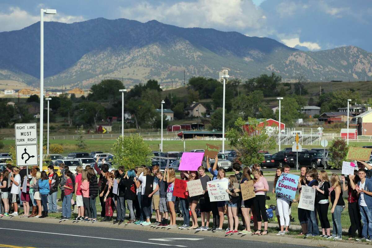 In this Sept. 23, 2014 photo, high school students hold a protest against a Jefferson County School Board proposal to emphasize patriotism in the teaching of U.S. history, at Ralston Valley High School, in Arvada, Colo.