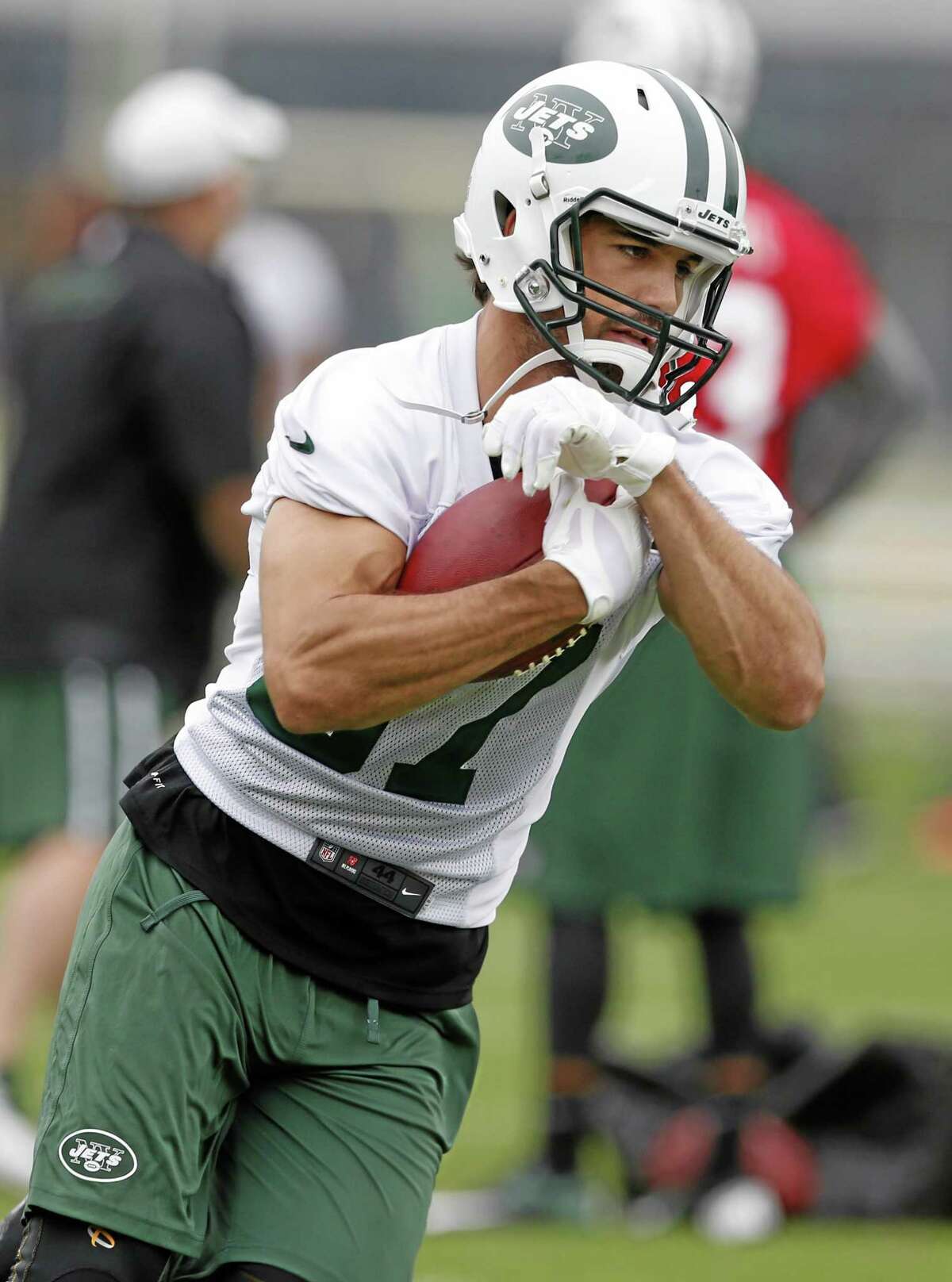 In this May 28 file photo, New York Jets wide receiver Eric Decker runs with the ball during an organized team activity in Florham Park, New Jersey.