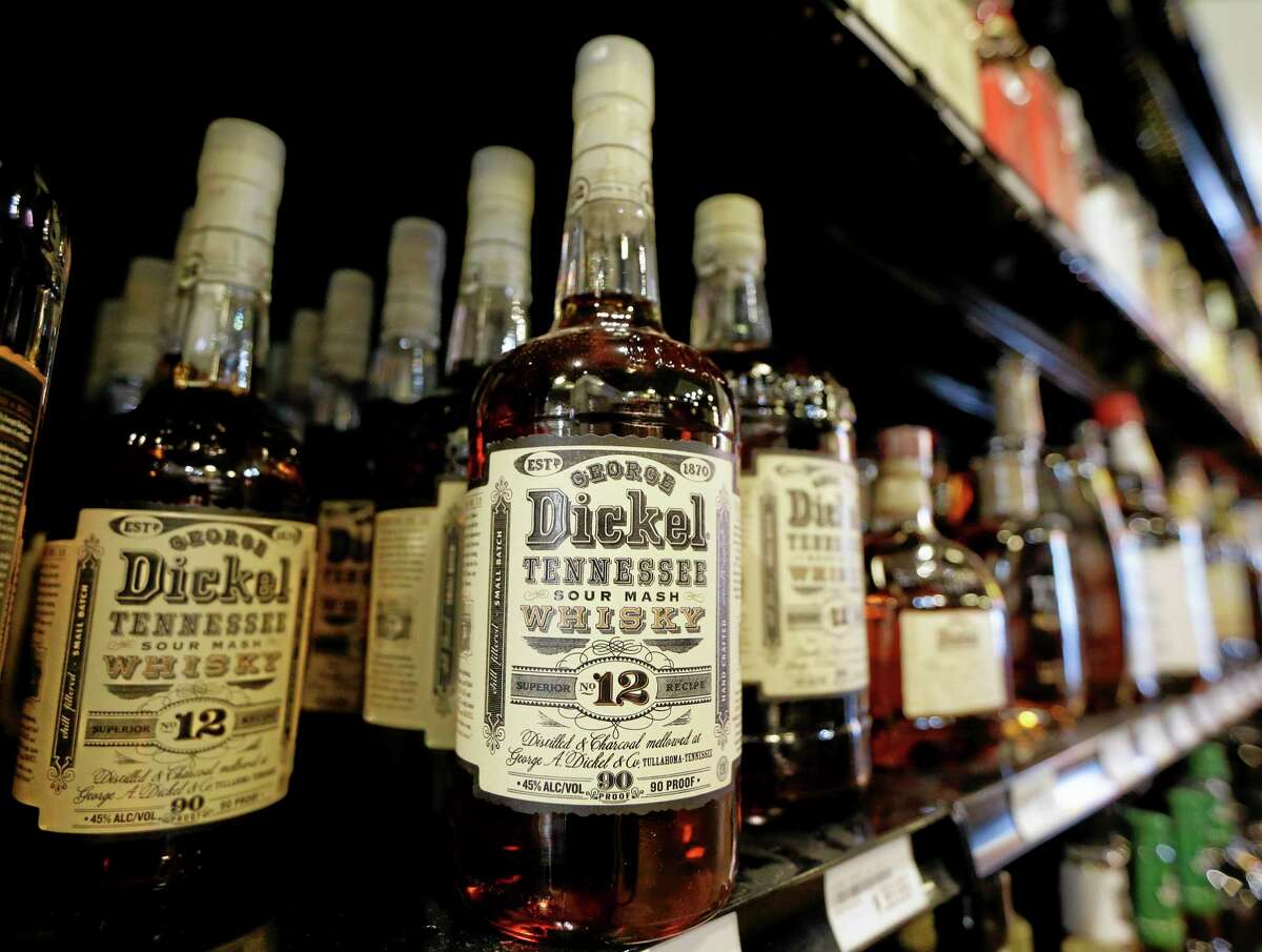 Bottles of George Dickel Tennessee whiskey are displayed in a liquor store Tuesday, June 10, 2014, in Nashville, Tenn. Alcohol regulators ended their investigation into whether George Dickel, a subsidiary of liquor giant Diageo, violated state laws by storing whiskey in neighboring Kentucky. (AP Photo/Mark Humphrey)
