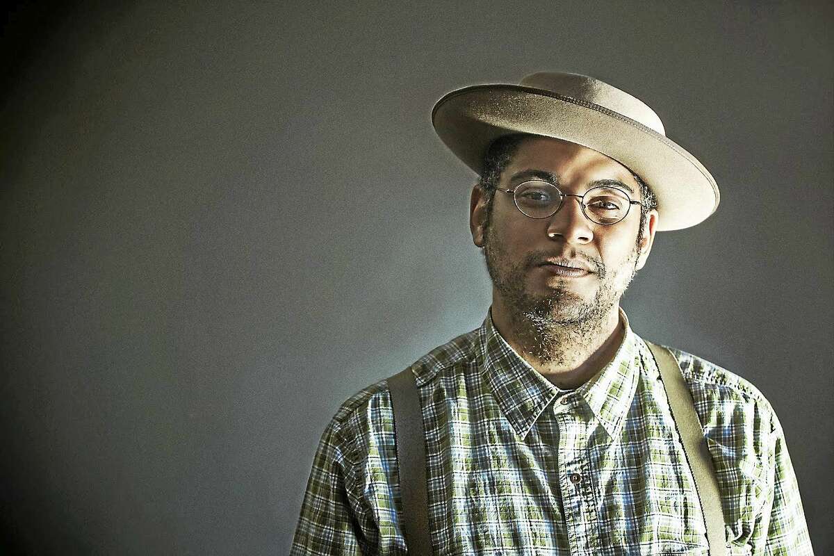 Dom Flemons says he incorporates his background in percussion in his banjo playing, which includes not only traditional clawhammer banjo, but also the tenor and three-finger styles of playing.