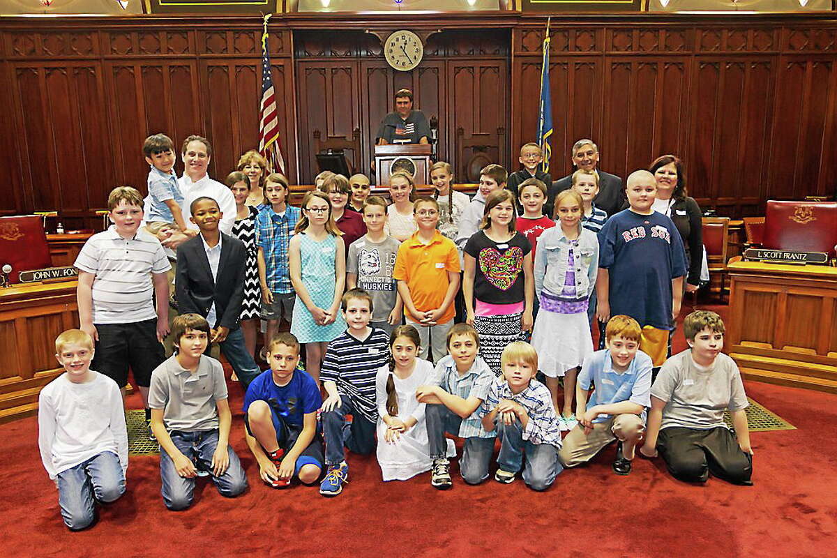 State Sen. Len Fasano, R-34, and Rep. Dave Yaccarino, R-87, join a group of North Haven students from Green Acres Elementary School at the State Capitol. The fourth- and fifth-graders learned how a bill becomes law, toured the Capitol and got an inside look at the floor of the House of Representatives and Senate. Image 1: Fasano with teachers Connie Schingh, left, and Dede Mahone.