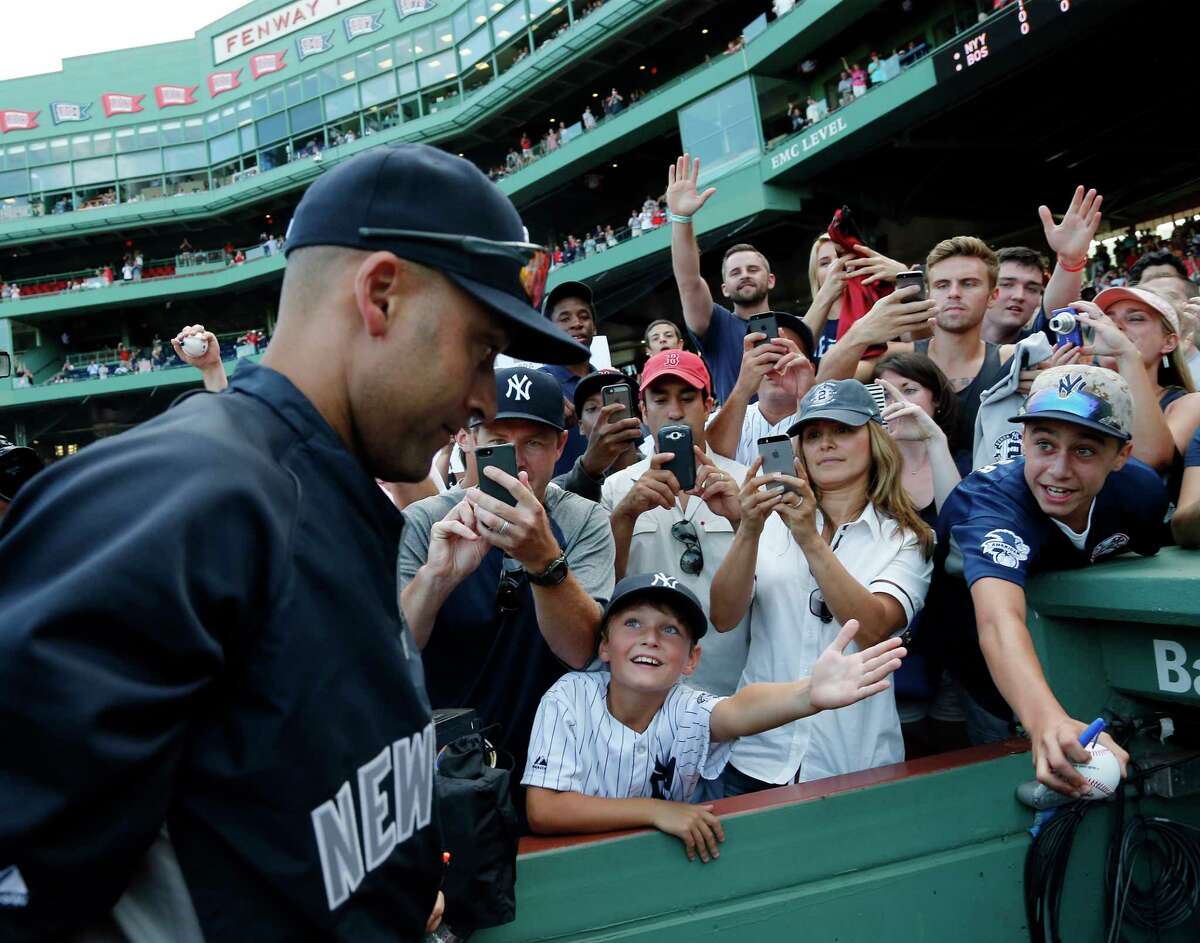 Derek jeter in boston red sox jersey and hat