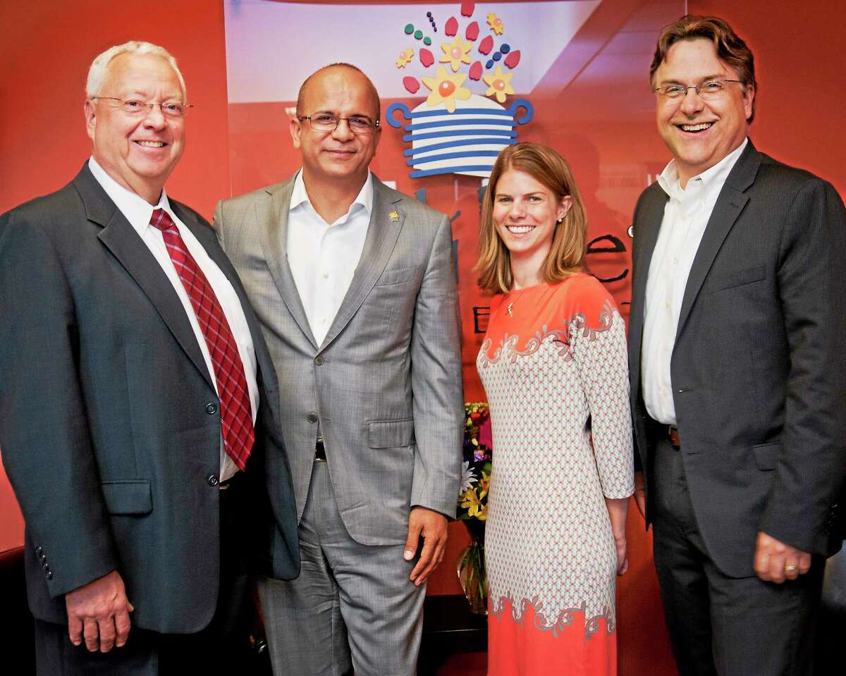 From left, New Haven Register CFO John Collins; Edible Arrangements International Inc. CEO Tariq Farid; Mary-Kate Bzdyra of the New Haven Register; and Tom Wiley, executive vice president, sales, at Digital First Media.