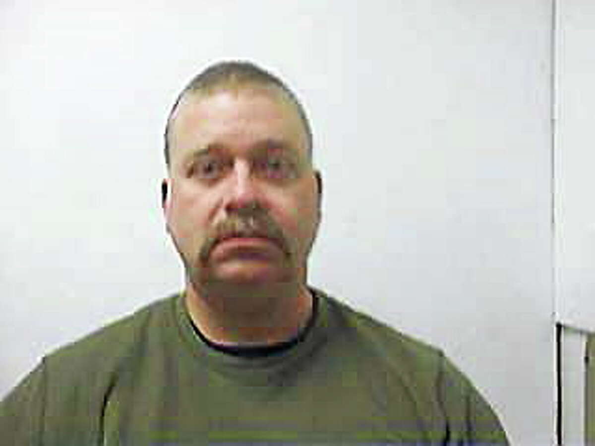 Mark Powell, former paramedic, accused of sexually assaulting woman in an ambulance.