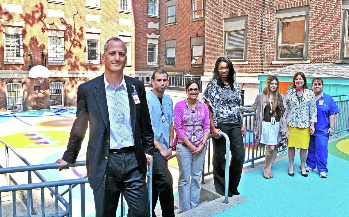 Dr. Andres Martin and his team at the Children’s Psychiatric Inpatient Center are seen in the Terry’s Dream playground.