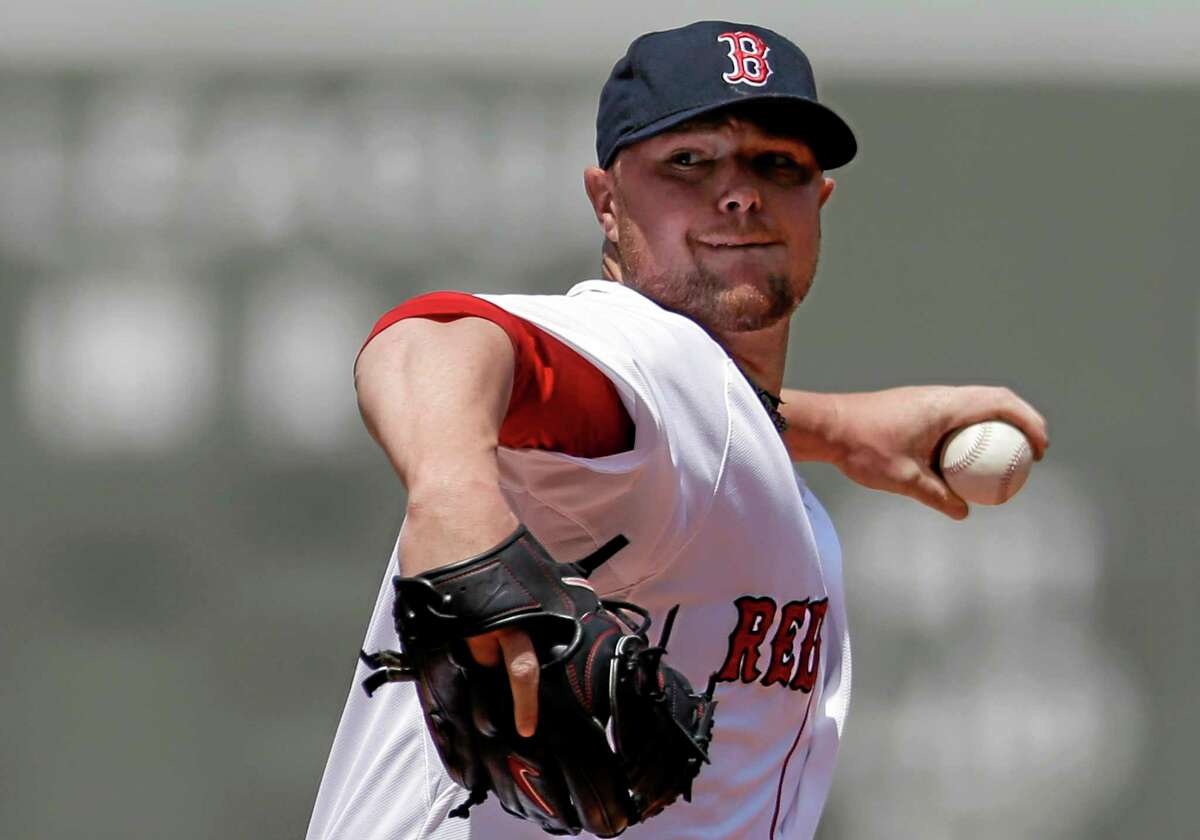 The Red Sox’s Jon Lester winds up for a pitch against the Tampa Bay Rays on Sunday. The Red Sox 4-0.