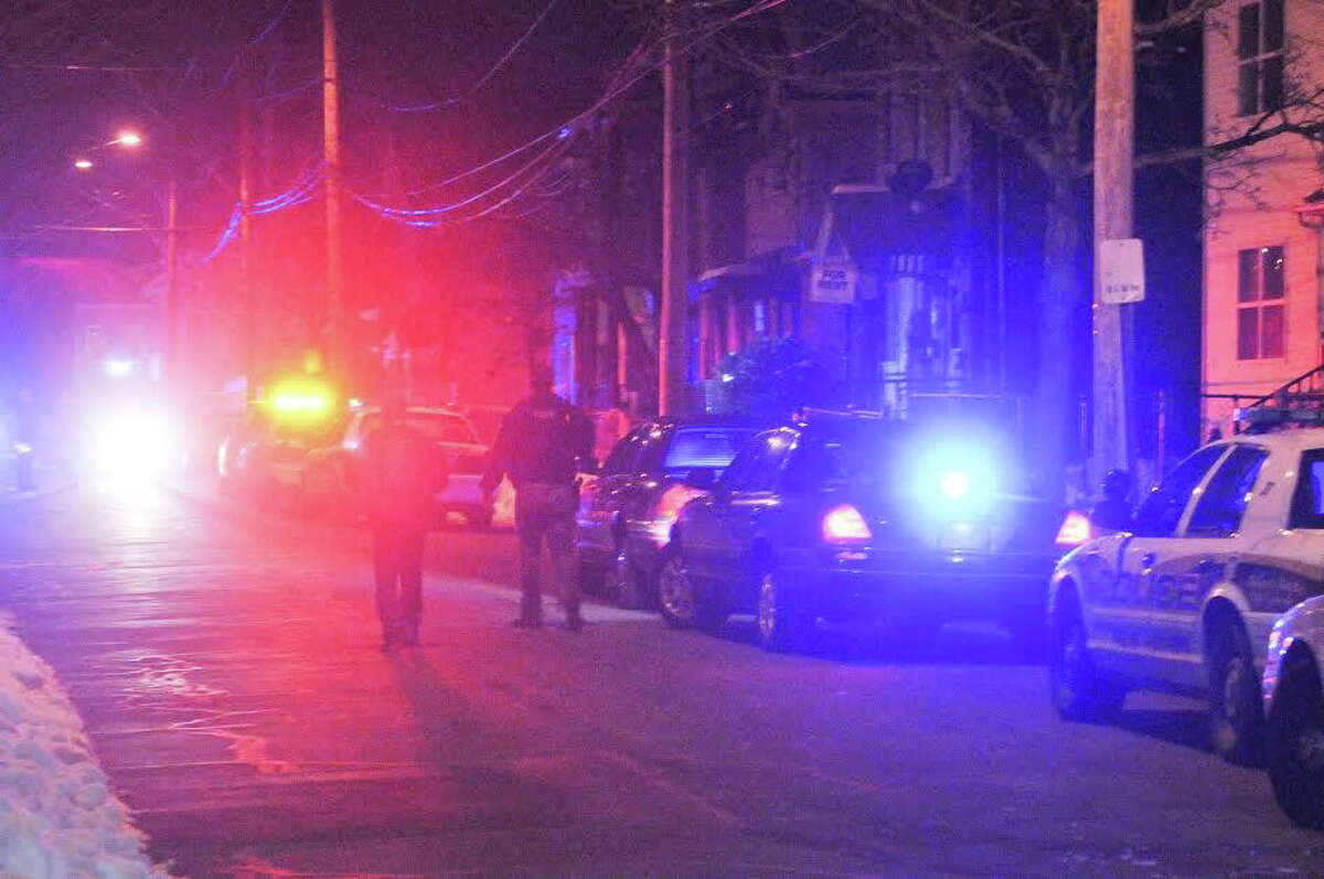Police investigate the scene of a homicide on Kossuth Street Monday night in New Haven.