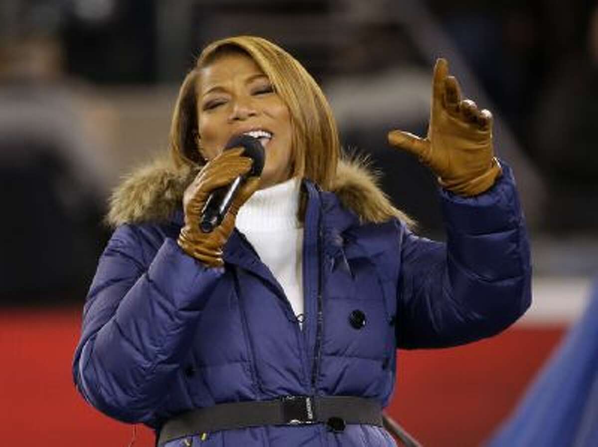 Queen Latifah sings "America the Beautiful" before the NFL Super Bowl XLVIII football game between the Seattle Seahawks and the Denver Broncos Sunday, Feb. 2, 2014, in East Rutherford, N.J.