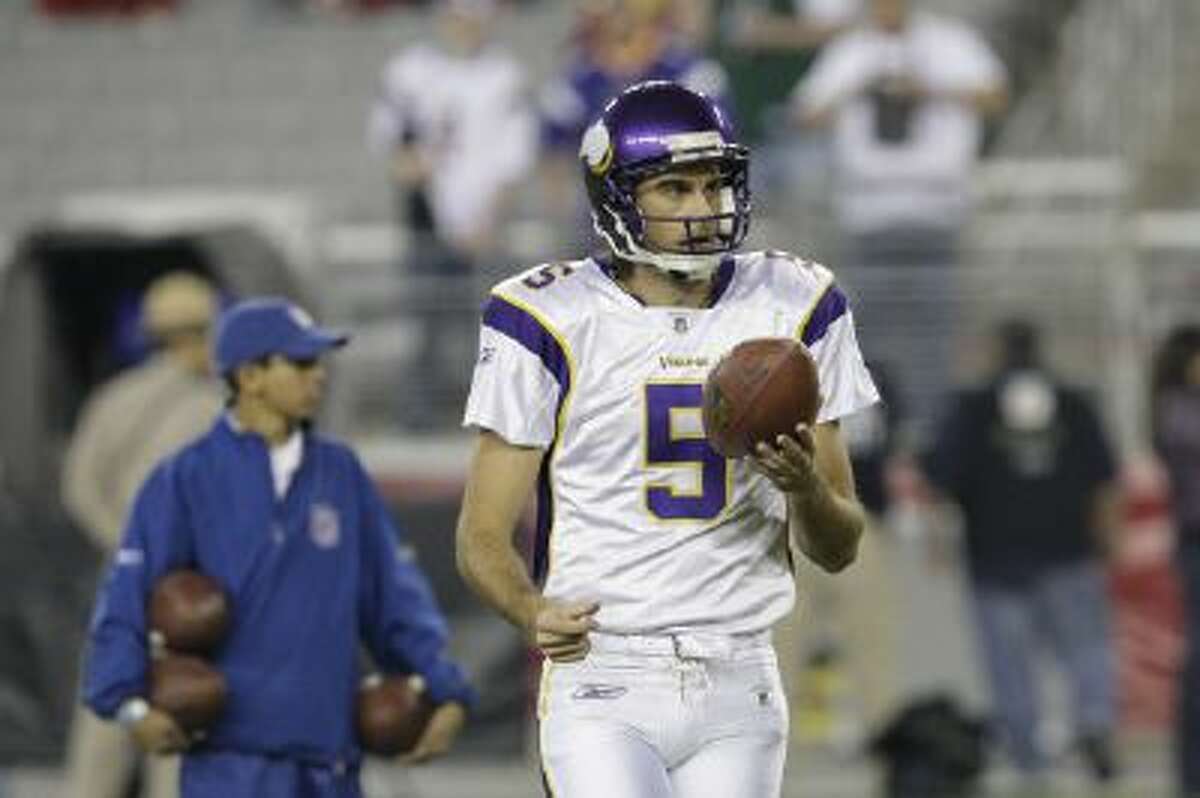 Chris Kluwe warms up before a 2009 game against the Arizona Cardinals.