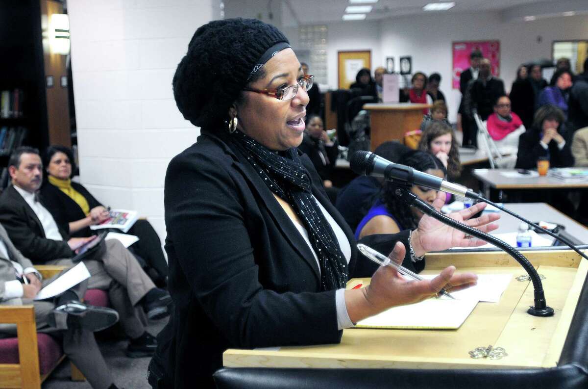Arnold Gold — New Haven Register Tonya Jackson, parent of an Amistad Academy student, speaks highly of New Haven Superintendent of Schools Garth Harries at a Board of Education meeting at Hill Regional Career High School Monday.