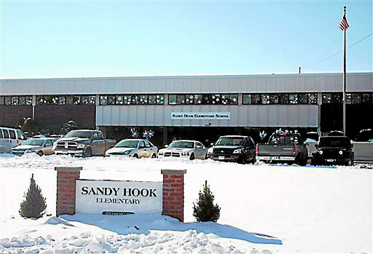 This photo provided by the Monroe Police Department shows the new Sandy Hook Elementary School on the first day of classes in Monroe, Conn., Thursday, Jan. 3, 2013. The school, formerly known as Chalk Hill School, was overhauled especially for the students from the Sandy Hook School shooting in Newtown, in the neighboring town of Monroe, Conn. (AP Photo/Monroe Police Department)
