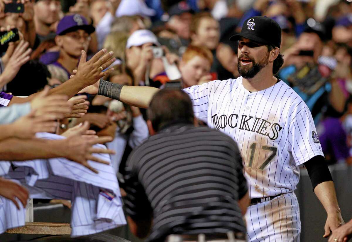 Helton homers in final game in Colorado; Rockies fall to Red Sox
