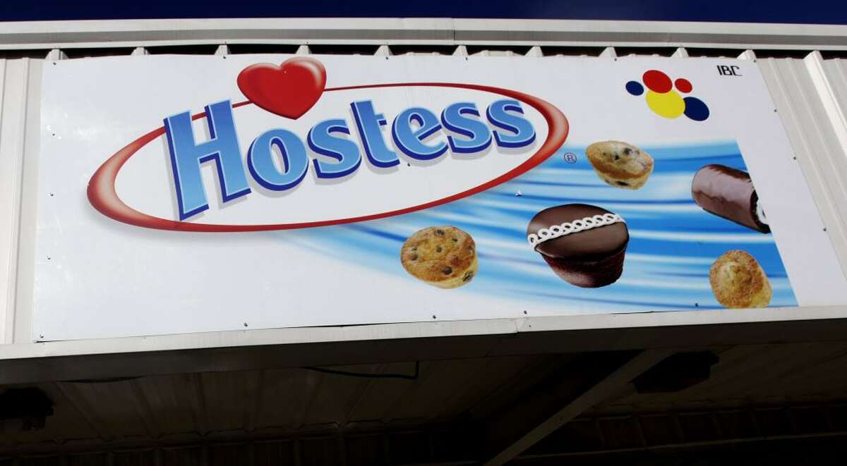 A Hostess sign is shown on a closed retail outlet store in Garland, Texas, Wednesday, Jan. 11, 2012. Hostess Brands Inc., the maker of Twinkies and Wonder Bread, is seeking bankruptcy protection, blaming its pension and medical benefits obligations, increased competition and tough economic conditions. The filing on Wednesday comes just two years after a predecessor company emerged from bankruptcy proceedings. (AP Photo/LM Otero)