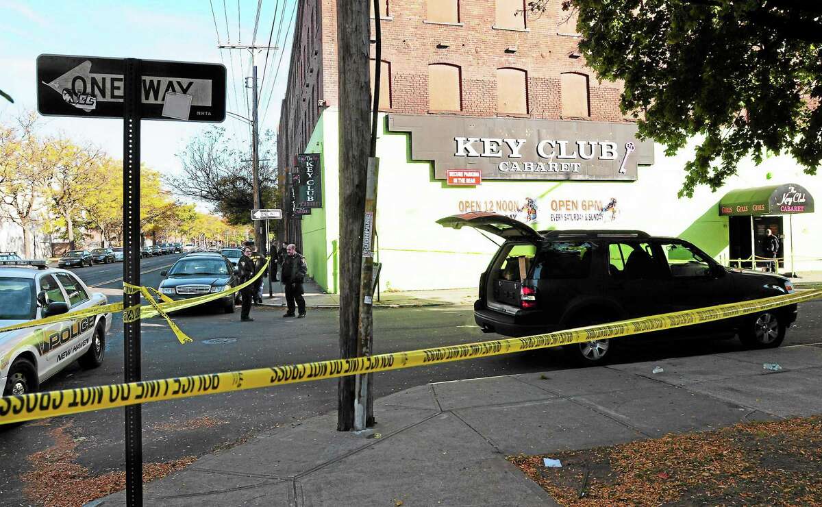 (Peter Hvizdak — Register)Saturday October 26, 2013(Peter Hvizdak — Register)New Haven Police investigate the crime scene where one woman is dead, two people are listed in critical condition and three are being treated for non-life threatening wounds and injuries after a shooting at the Key Club Cabaret at 85 Saint John St. near Hamilton St. Saturday morning October 26, 2013.
