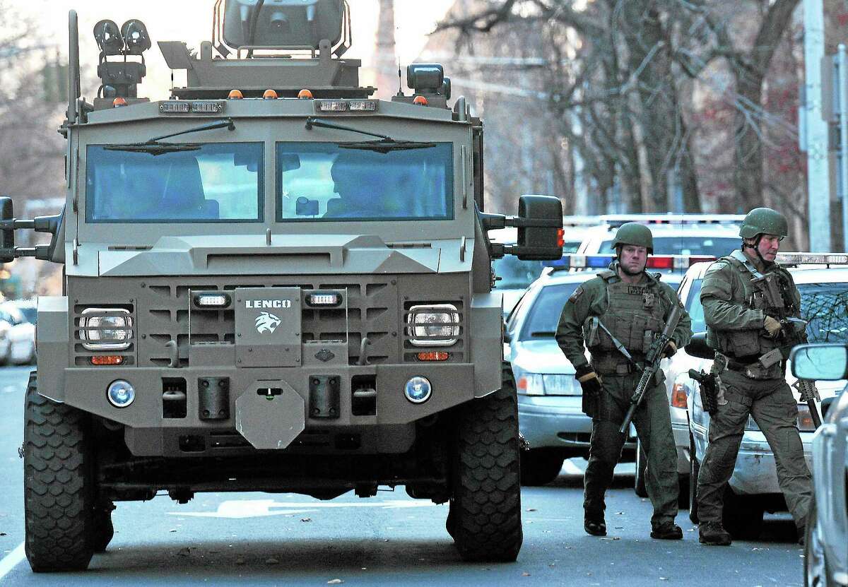 (Peter Casolino ‚Äî New Haven Register) SWAT teams prepare to search more of Old Campus during the Yale lockdown Monday afternoon. pcasolino@NewHavenRegister