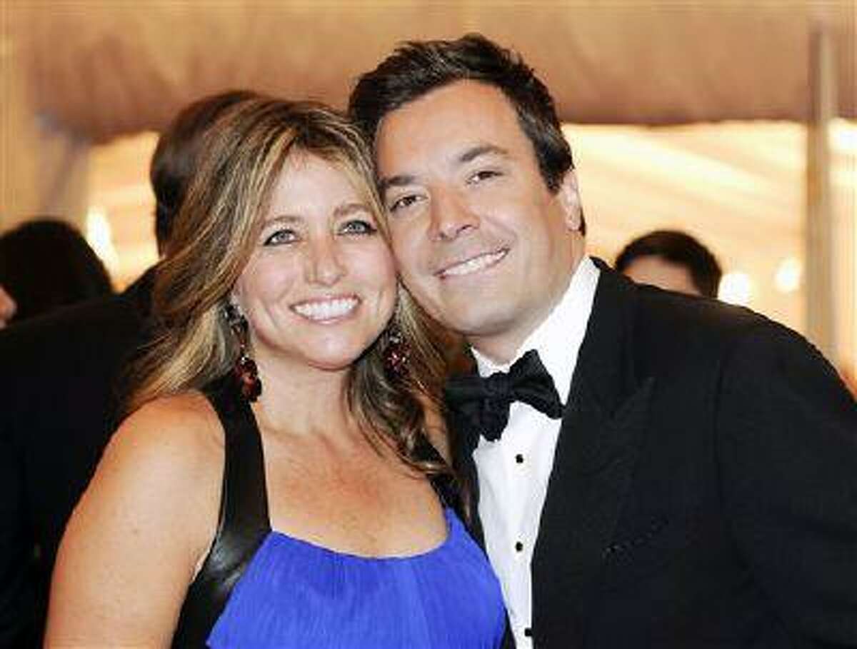 FILE - This May 7, 2012 file photo shows Jimmy Fallon and his wife Nancy Juvonen, left, at the Metropolitan Museum of Art Costume Institute gala benefit, celebrating Elsa Schiaparelli and Miuccia Prada in New York. A representative says Fallon and his wife, Nancy Juvonen Fallon, welcomed a baby daughter on Tuesday, July 23, 2013. (AP Photo/Evan Agostini, File)