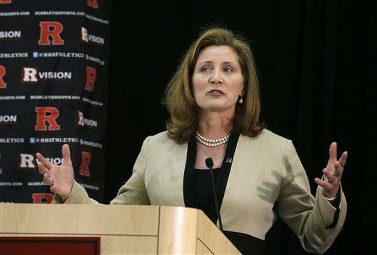 FILE - In this Wednesday, May 15, 2013 file photo, Julie Hermann speaks during a news conference where she was introduced as the new athletic director at Rutgers University, in Piscataway, N.J. Hermann, hired to clean up Rutgers' scandal-scarred athletic program, quit as Tennessee's women's volleyball coach 16 years ago after her players submitted a letter complaining she ruled through humiliation, fear and emotional abuse, The Star-Ledger reported Saturday, May 25, 2013, on its website. (AP Photo/Mel Evans, File)