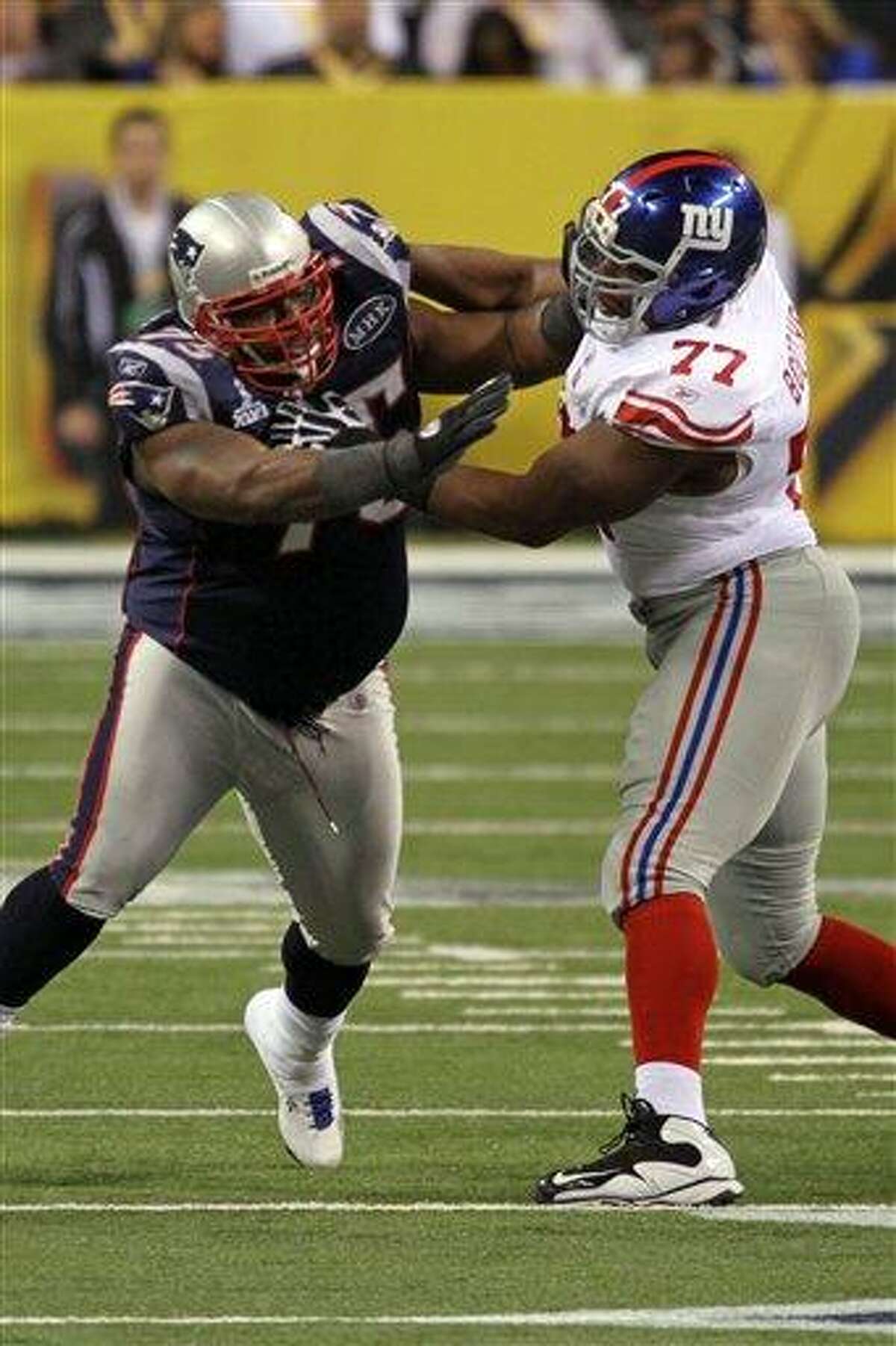 New England Patriots Vince Wilfork #75 in action against New York Giants Kevin Boothe #75 at Super Bowl XLVI on Sunday, February 5, 2012 in Indianapolis, IN. The Giants defeated the Patriots 21-17. (AP Photo/Gregory Payan)