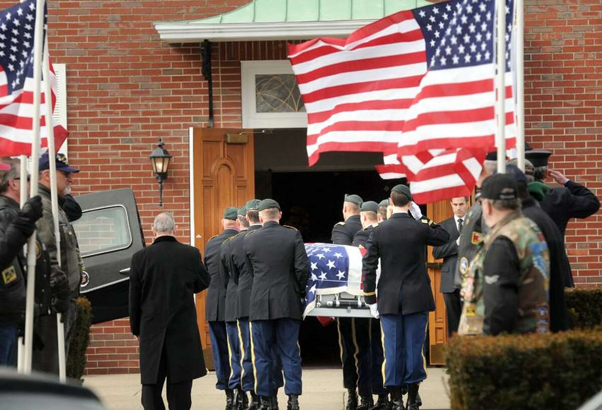 St. George Church, Guilford: The casket of Capt. Andrew Pedersen-Keel, killed in Afghanistan, was brought into the church for his funeral. Mara Lavitt/New Haven Register3/25/13