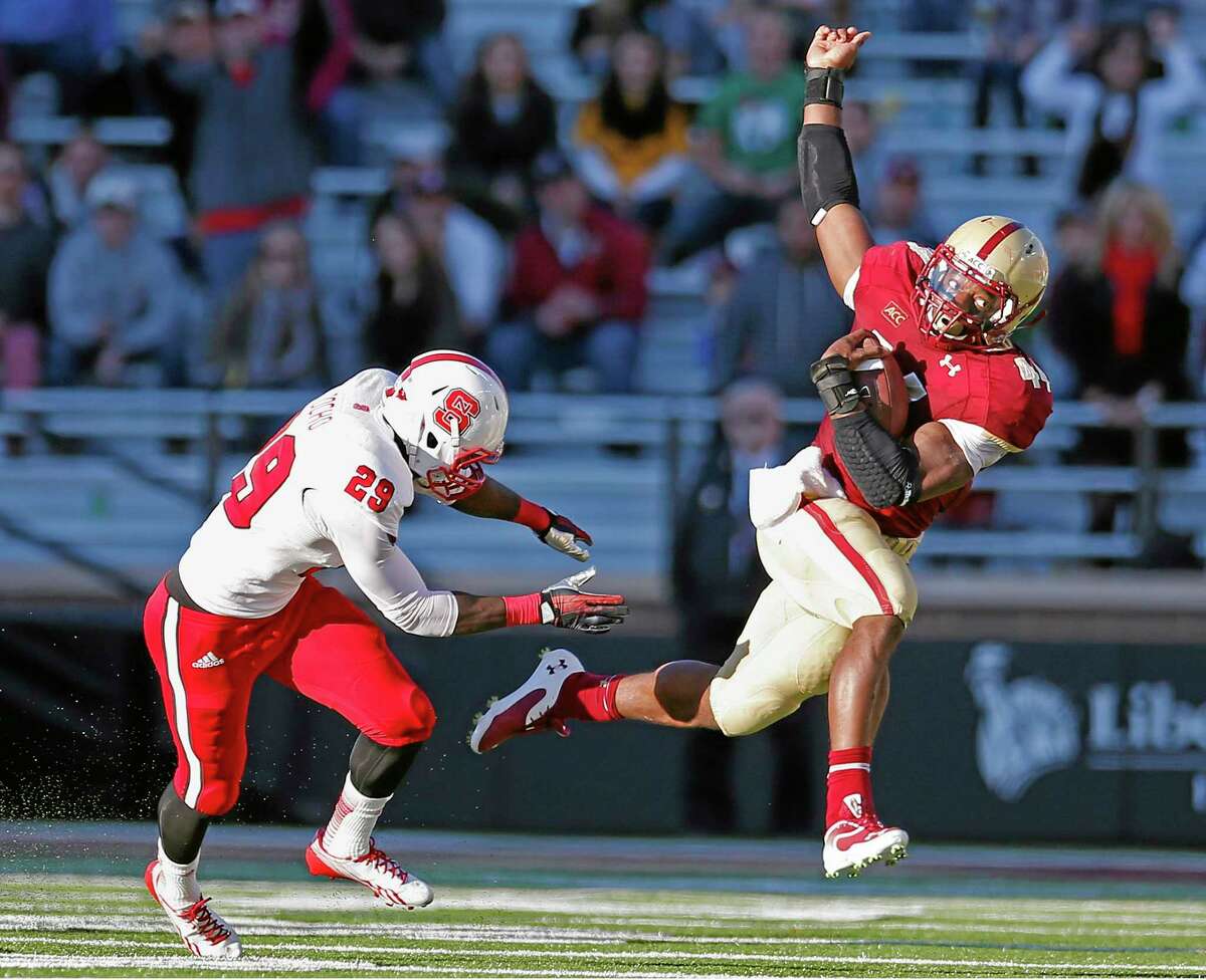 Boston College running back Andre Williams (44) tries to evade North Carolina State cornerback Jack Tocho (29) in the third quarter of their game on Saturday.