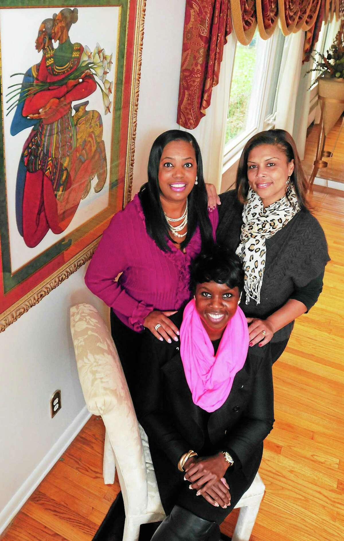 (Peter Hvizdak — New Haven Register)African-american women (left to right) Doris Dumas, Nicole Murphy and Vera Esdaile, all of New Haven, Saturday November 9, 2013,describe what it means to have Toni Harp as their new mayor in New Haven.ee