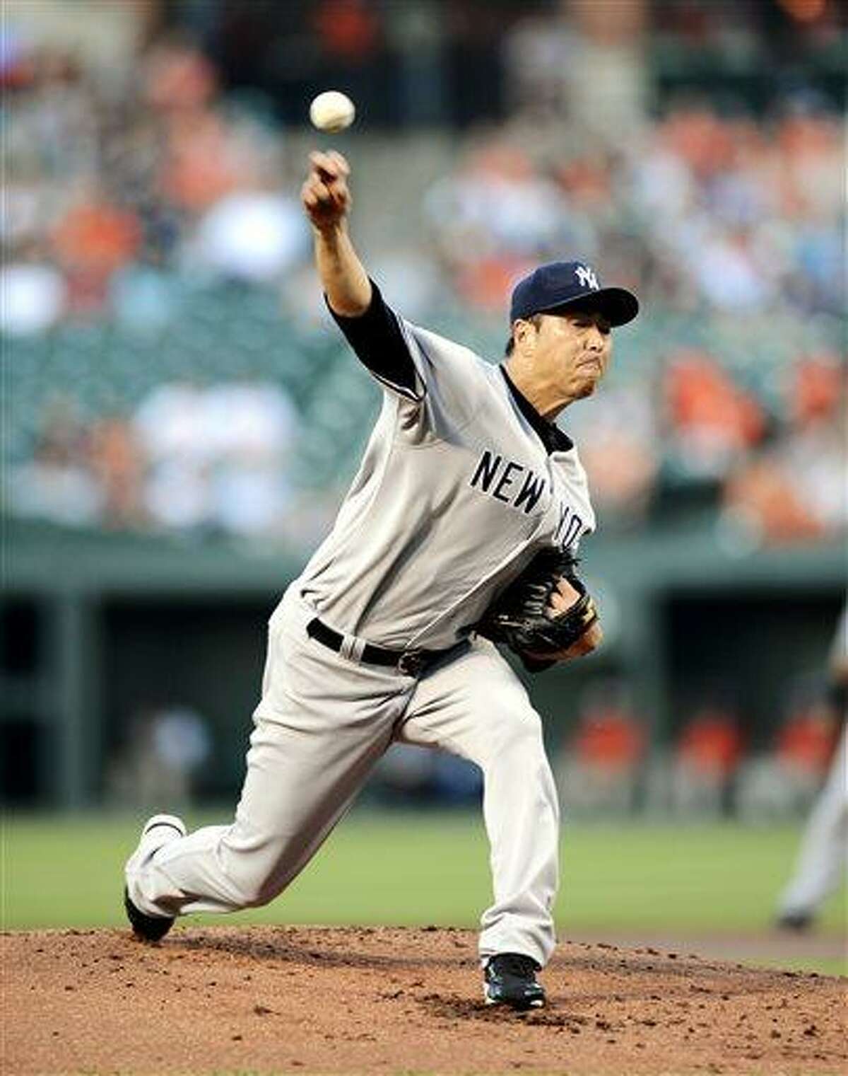 New York Yankees starting pitcher Hiroki Kuroda, of Japan, delivers against the Baltimore Orioles during the first inning of a baseball game, Wednesday, May 22, 2013, in Baltimore. (AP Photo/Nick Wass)