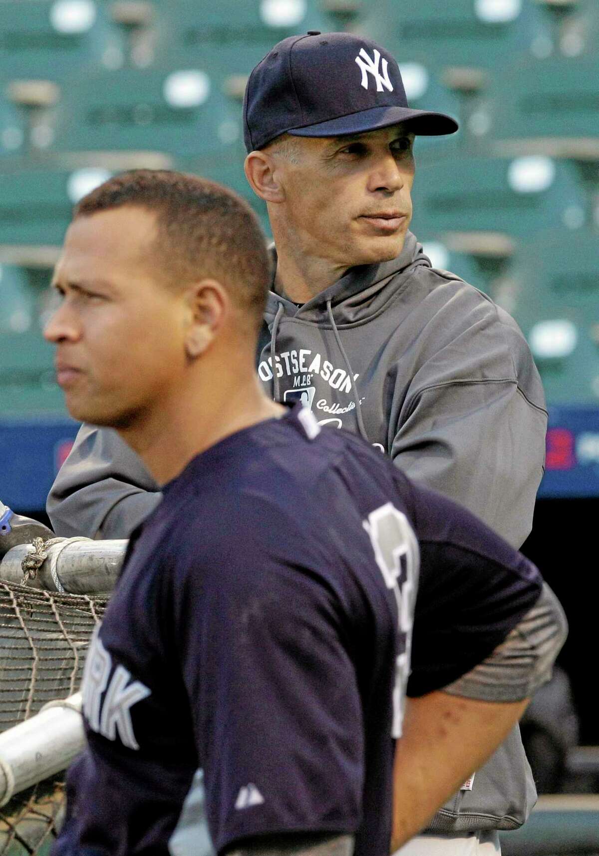 New York Yankees manager Joe Girardi, right, says the length of Alex Rodriguez’s grievance hearing complicates the team’s offseason planning. The players’ association is trying to overturn a 211-game suspension given to the third baseman last August for alleged violations of baseball’s drug program and labor contract. Girardi said Thursday that if a decision isn’t made soon, the team will have to make backup third base plans in case Rodriguez isn’t available.