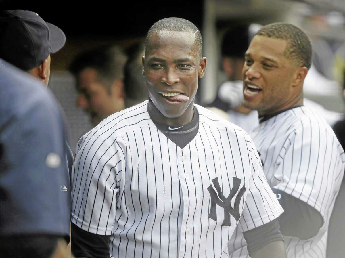 The Yankees’ Alfonso Soriano celebrates with teammates in the dugout during New York’s eight-run fourth inning against the Chicago White Sox at Yankee Stadium on Monday.