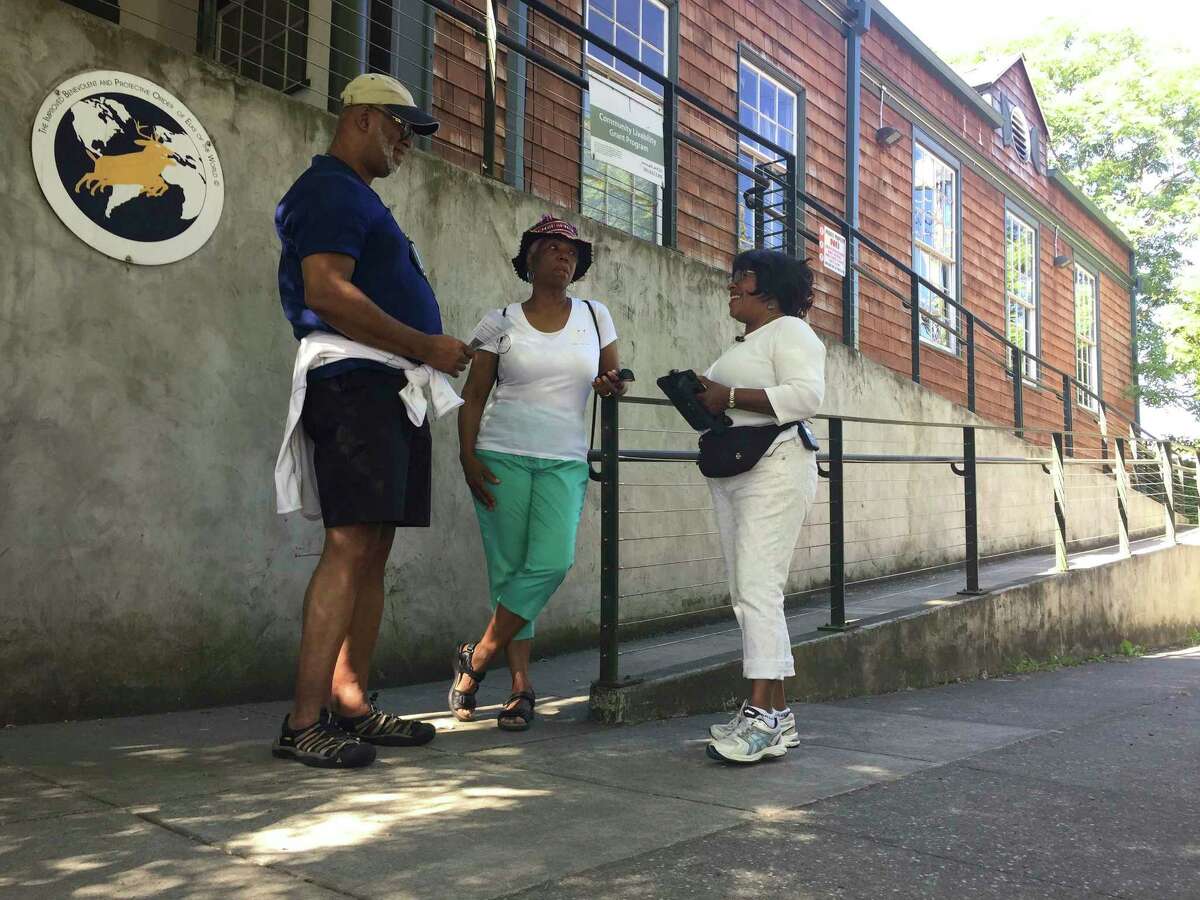 ﻿Ron Young, left, Gahlena Easterly and Sharon Steen reminisce as they ﻿﻿walk through ﻿Portland, Ore. streets that once were full of black-owned homes and businesses.﻿