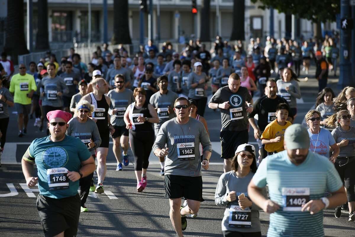 Half marathon participants of the 2017 San Francisco Marathon run along the Embarcadero in San Francisco, CA, on Sunday July 23, 2017.