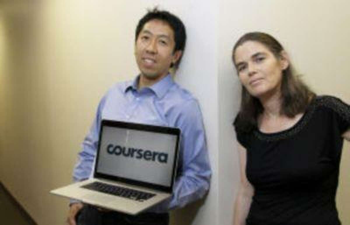 In this Aug. 2, 2012 photo, Andrew Ng and Daphne Koller, Stanford University computer science professors who started Coursera, pose for a photo at the Coursera office in Mountain View, Calif. (AP Photo/Jeff Chiu)