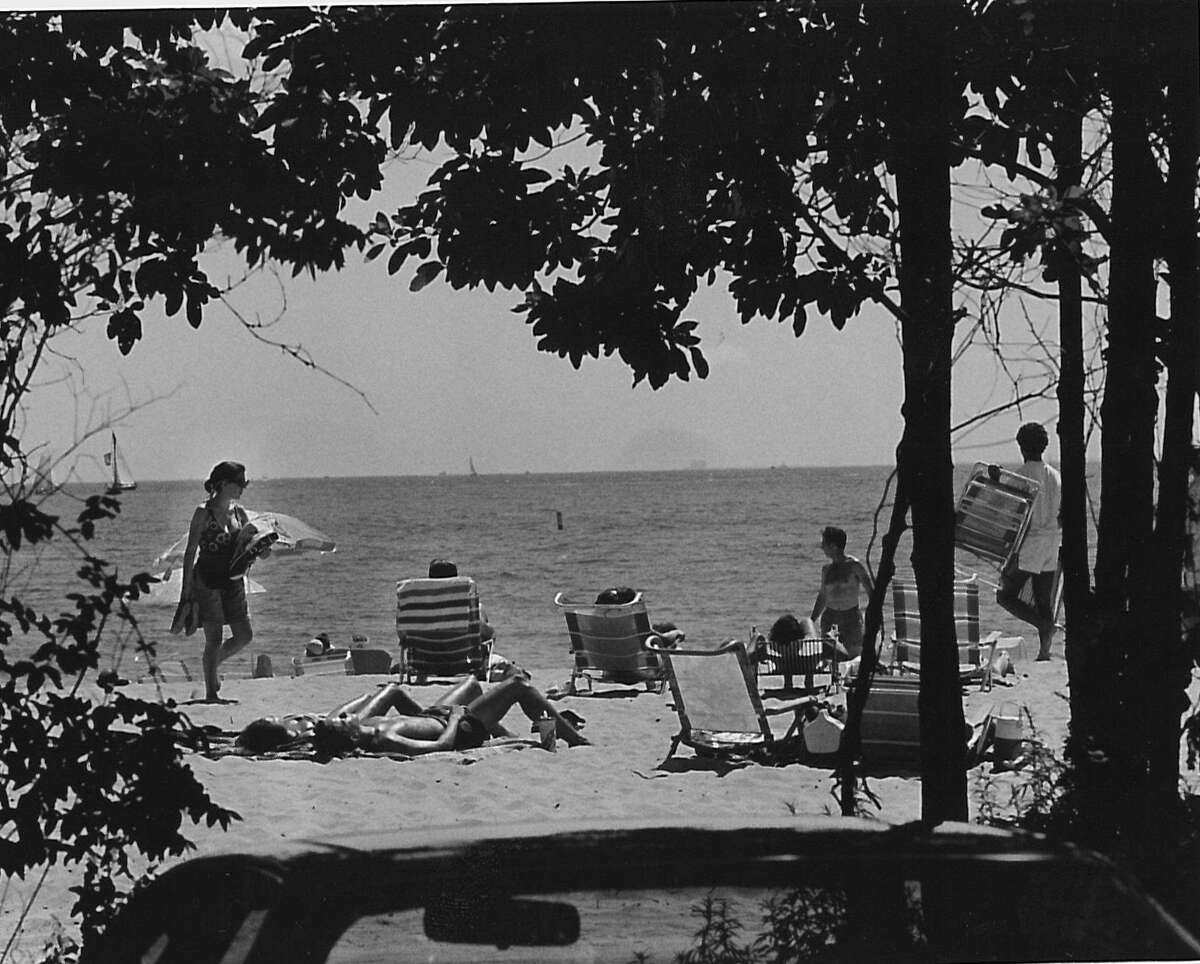 Beach goers enjoying the sun and surf at Greenwich Point on July 18, 1993.
