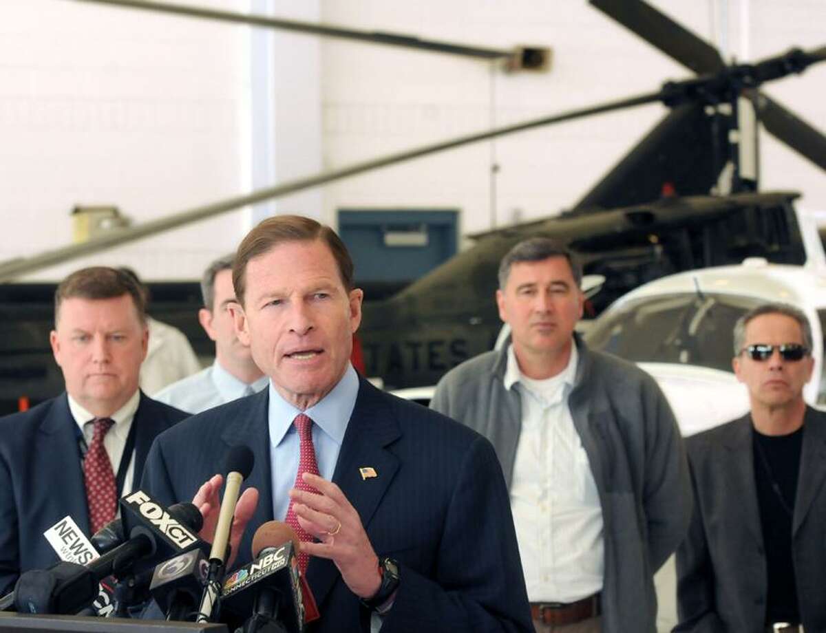 Brainard Airport hangar: US Sen. Richard Blumenthal announced a bi-partisan legislative initiative to save small airports like Tweed-New Haven and Brainard Airport in Hartford from being closed by sequestration. Tweed's executive director Tim Larson is at left. Mara Lavitt/New Haven Register3/18/13