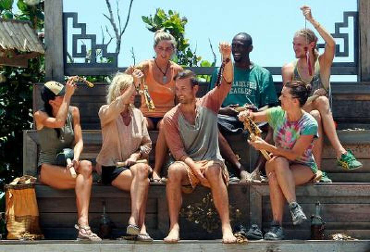 The Galang Tribe hold up their new buffs during the sixth episode of SURVIVOR: BLOOD vs. WATER, Wednesday, Oct. 23 (8:00-9:00 PM, ET/PT) on the CBS Television Network.
