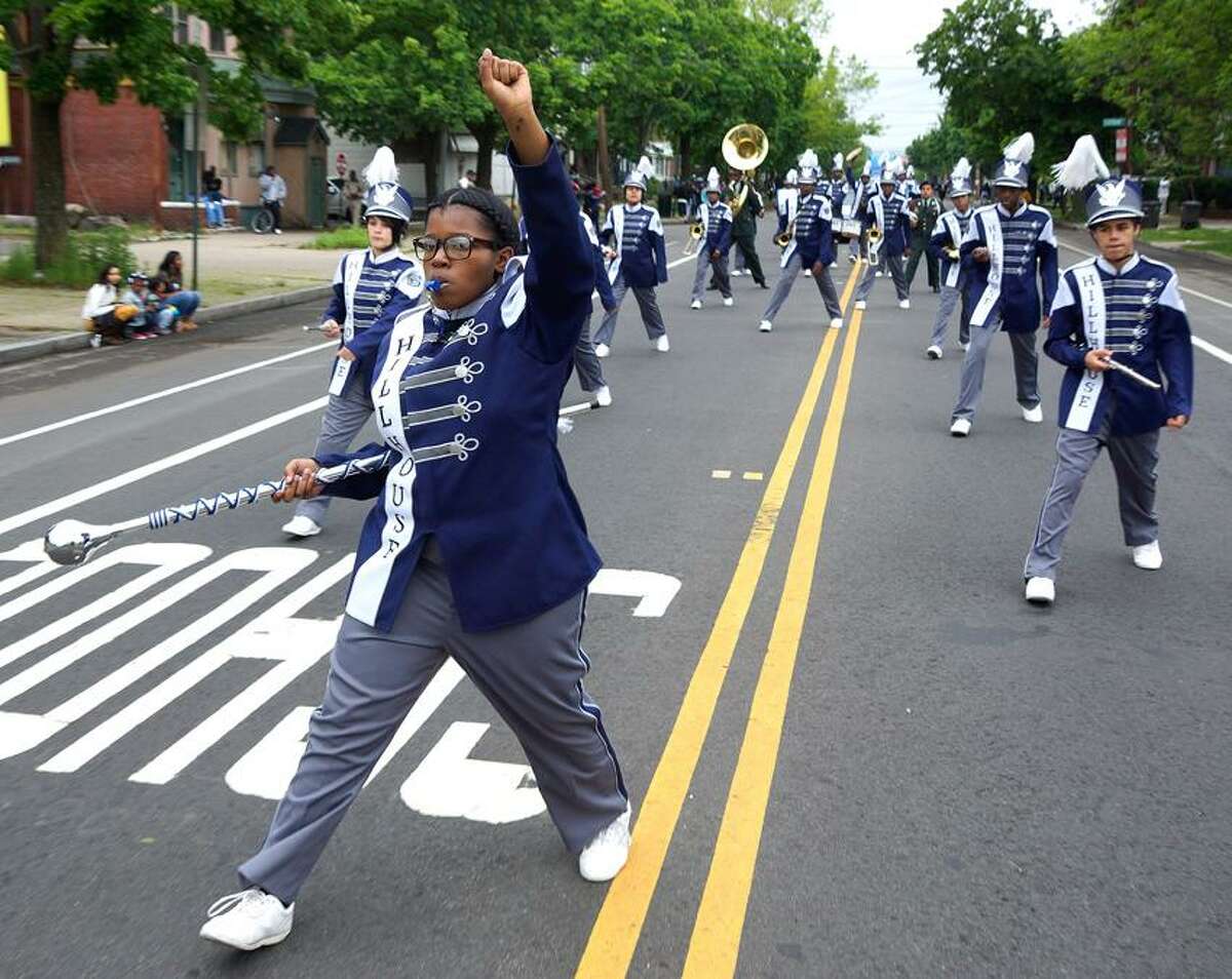 New Haven-- Julianne Bell leads the Hillhouse Marching Band in the Freddie Fixer Parade down Dixwell Ave from Hamden to New Haven Sunday. Photo-Peter Casolino/Register pcasolino@newhavenregister.com