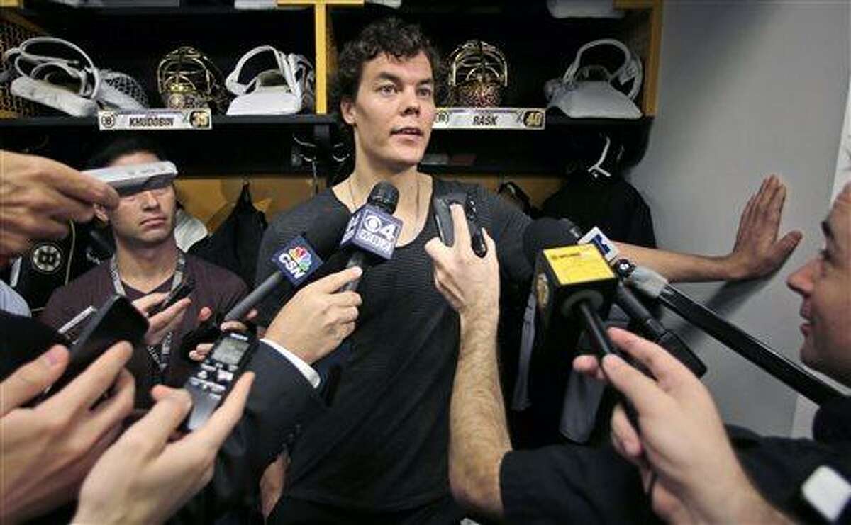 Boston Bruins goalie Tuukka Rask, of Finland, speaks to the media in the team locker room Wednesday, June 26, 2013, in Boston, two days after losing to the Chicago Blackhawks in the Stanley Cup Final. (AP Photo/Charles Krupa)