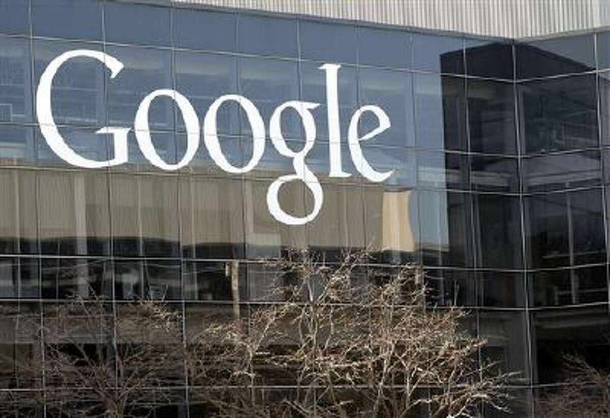This Jan. 3, 2013 file photo shows a Google sign at the company's headquarters in Mountain View, Calif.