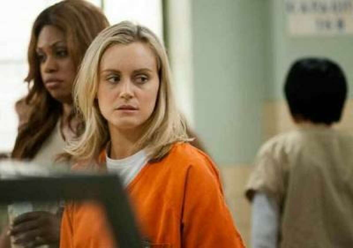 LIONSGATE TELEVISION A foolish choice made years ago lands Piper Chapman (played by Taylor Schilling) in prison in "Orange is the New Black," an Netflix original TV series.
