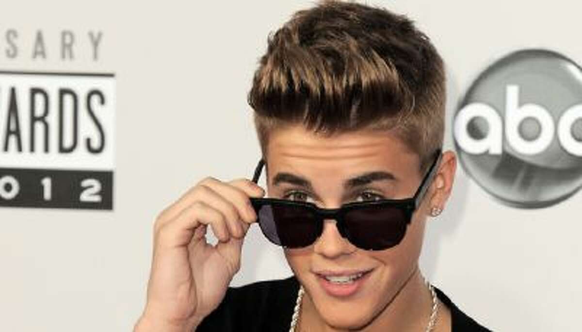 In this Nov. 18, 2012 file photo, Justin Bieber arrives at the 40th Anniversary American Music Awards in Los Angeles.