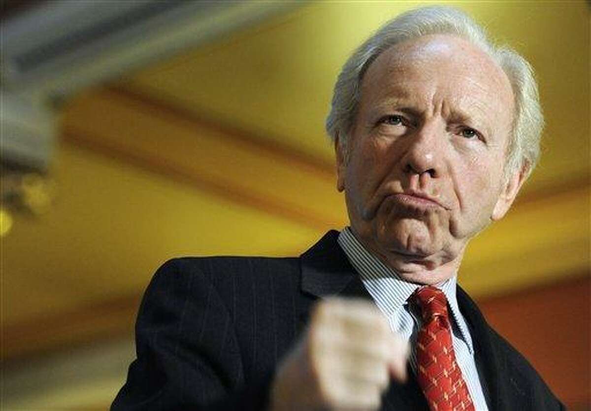 Sen. Joseph Lieberman, I-Conn., gestures with his fist during a news conference at the state capitol in Hartford, Conn., Monday, Dec. 10, 2012. Lieberman is kicking off a farewell tour with words of thanks for the people of Connecticut and warnings about dysfunction in Washington. Lieberman is retiring at the end of the session on Jan. 3 after 24 years in the Senate. (AP Photo/Jessica Hill)