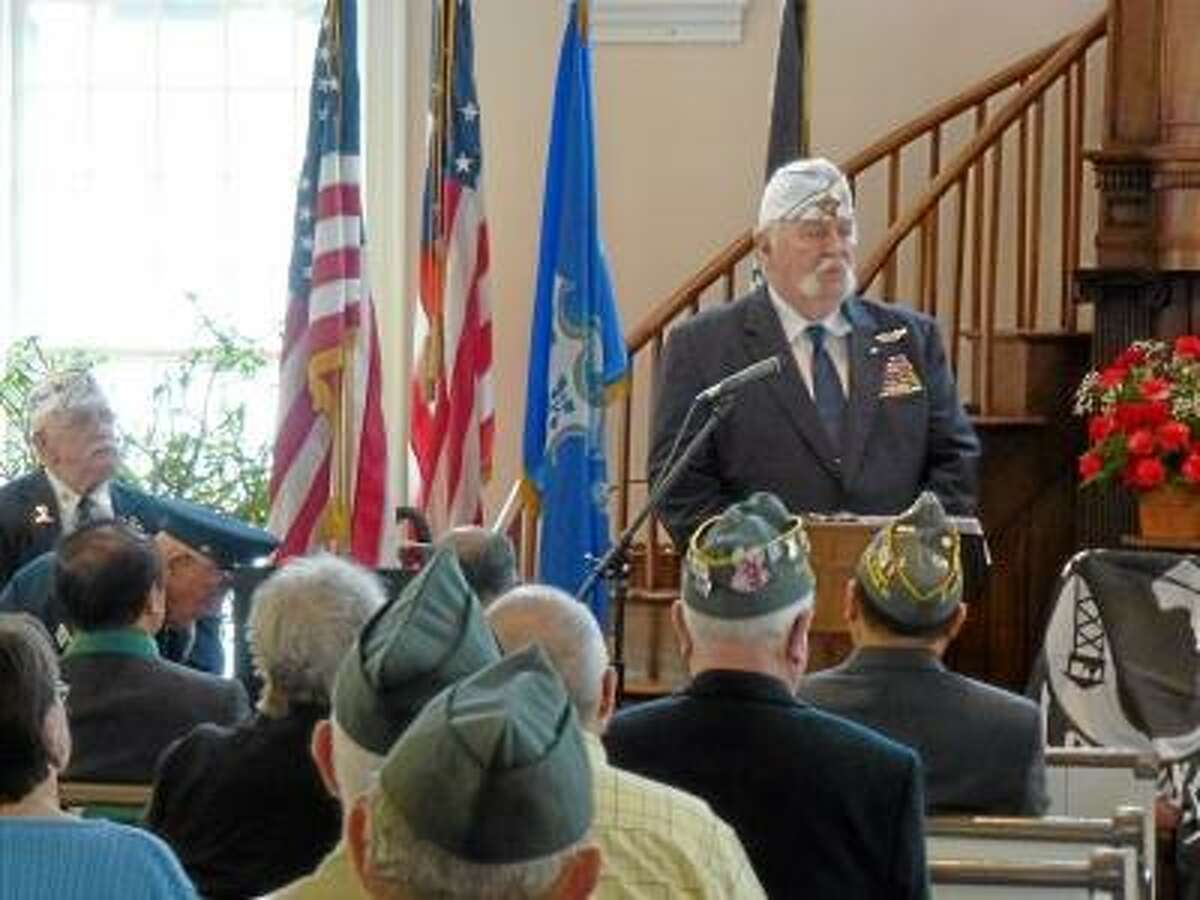 Ryan Flynn/Register Citizen - State AMVETS Commander John Harrison, a retired captain of the U.S. Air Force, gave an emotional speech about AMVETS and the group's mission.