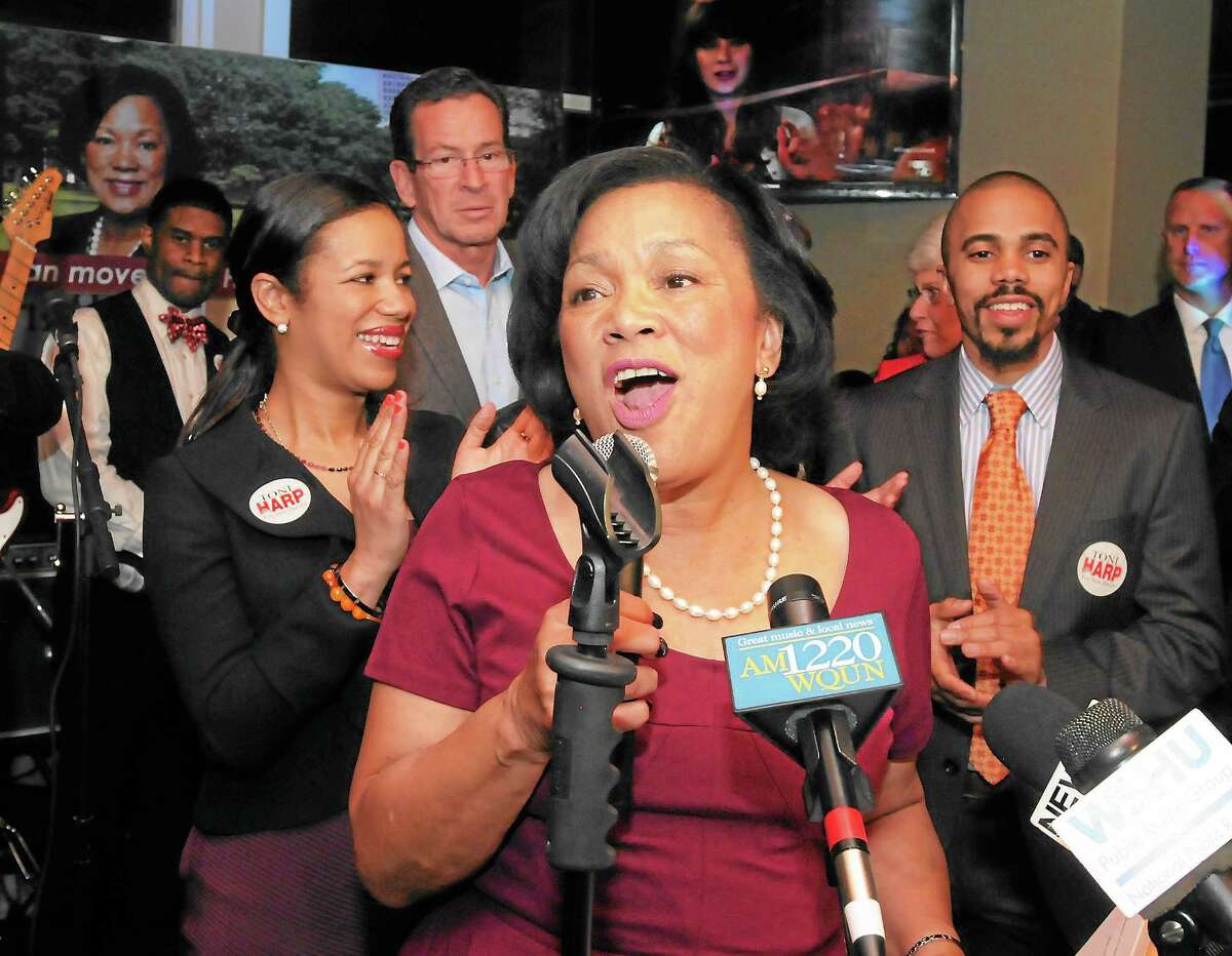(Mara Lavitt — New Haven Register) November 5, 2013 New HavenKelly's Pub: Toni Harp addresses supporters after her election as mayor of New Haven. At left is her daughter Djana, at right is her son Matthew. Governor Dannel Malloy is second from left.