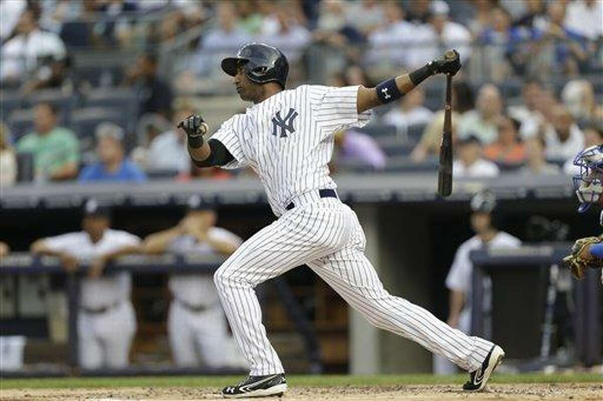 New York Yankees shortstop Eduardo Nunez bats in the first inning of the Yankees' loss to the Kansas City Royals Tuesday. (AP Photo/Kathy Willens).