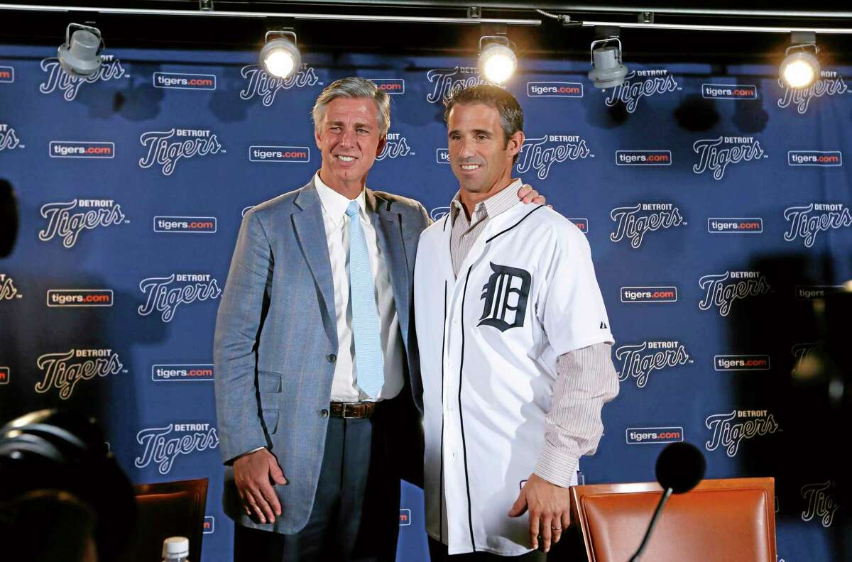 Detroit Tigers general manager David Dombrowski, left, introduces Brad Ausmus as the new Detroit Tigers manager during a news conference in Detroit Sunday.